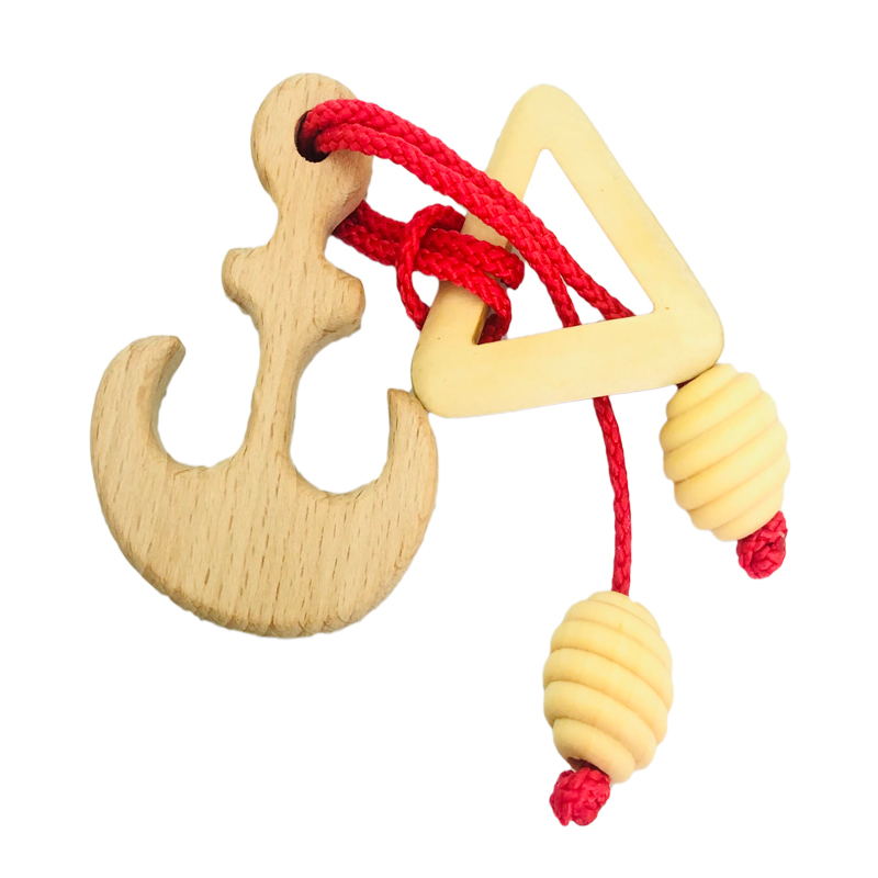 Casse tête bois ficelle et anneau Casse tête bois ficelle et anneau